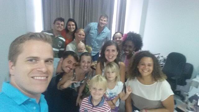 Some of my employees posing for a group pic at the office (and my kids).